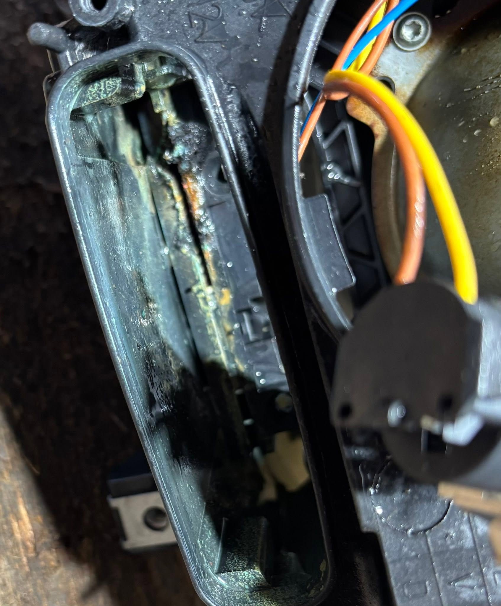 BMW H7 Headlight — Fire Damage Rebuild — damage detail